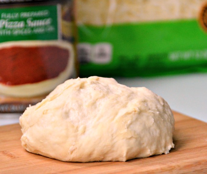 Just a few pantry ingredients will get this basic pizza dough recipe ready for baking in less than 10 minutes! | GrowingUpGabel.com