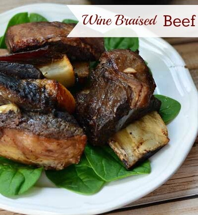 Braised in a red wine marinade all day in a slow cooker, beef short ribs fall right off the bone. Serve this delicious meal for company.