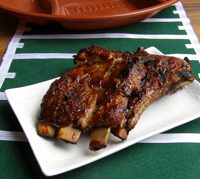 Slow cook spare ribs in a wet rub of liquid smoke and brown sugar and Coke. Finish on the grill with your favorite barbecue sauce for an easy grill recipe.