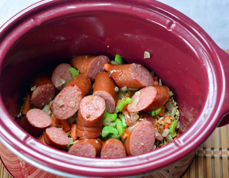 sausage and peppers in a slow cooker to make lentil soup