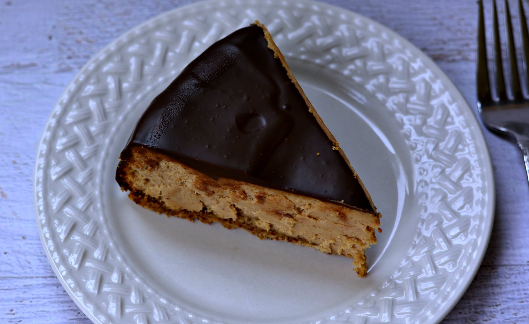 Enjoy a gluten free cheesecake made with almond butter and covered in chocolate! | GrowingUpGabel.com