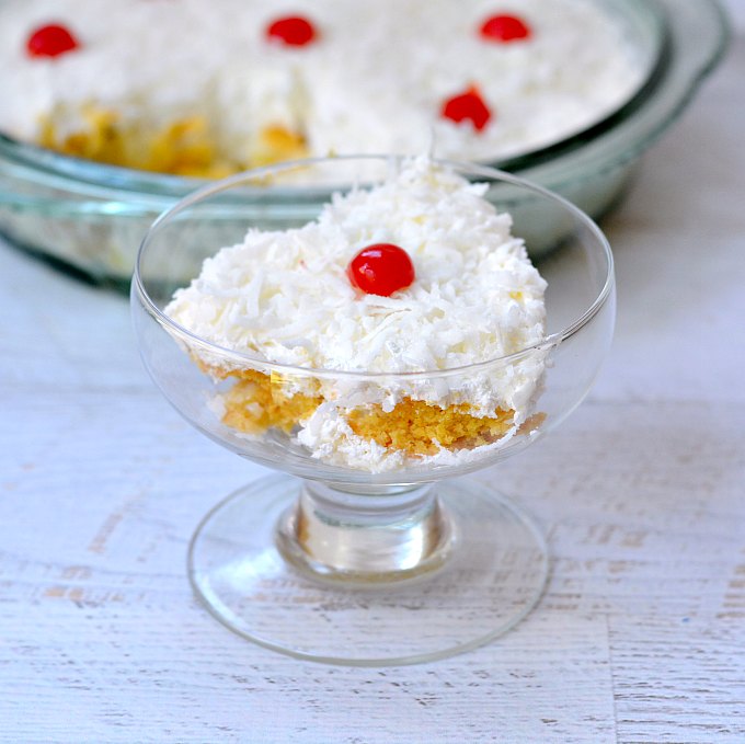 Easy no bake desserts are perfect for summer and this pina colada inspired treat is also quick to make!  Coconut, pineapple, and cherries are the stars of this simple dessert recipe. 