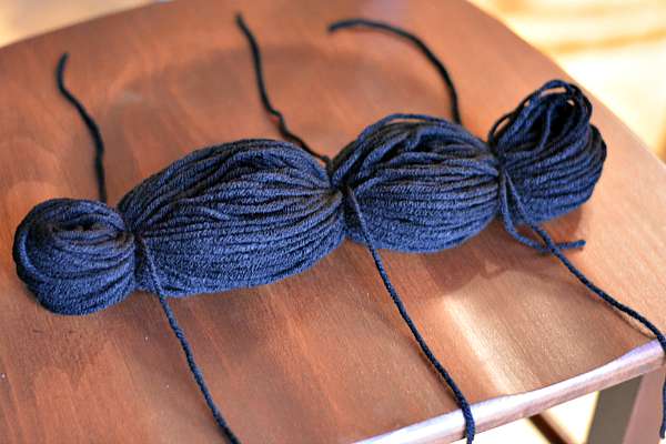 Black yarn tied off in sections.