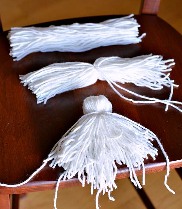 White yarn in 3 bundles made to look like a ghost.