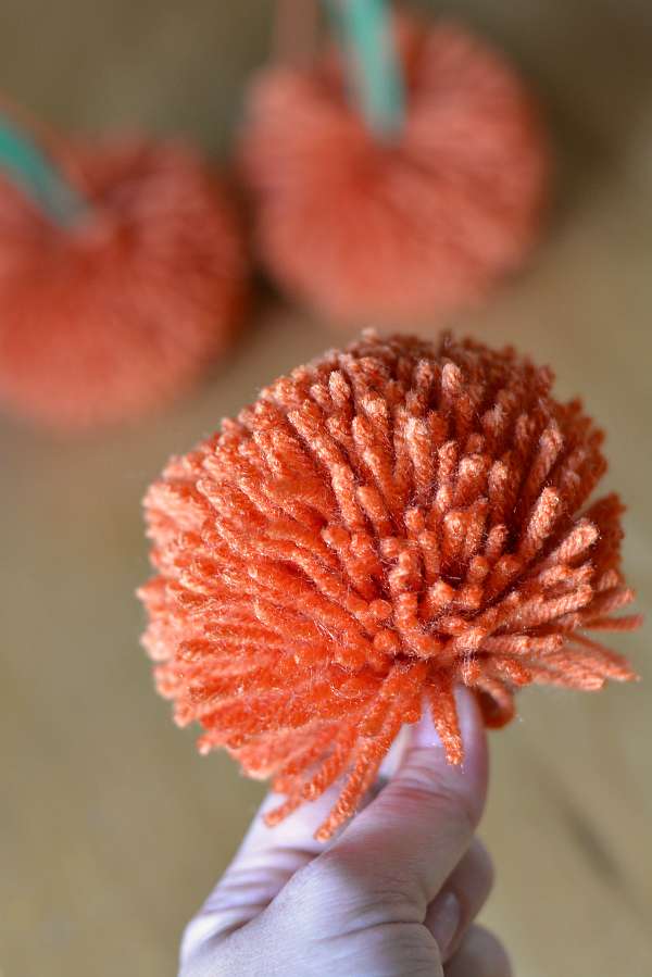 Orange yarn pom pom