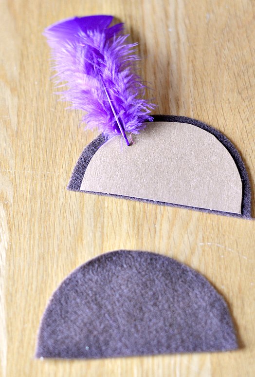 Felt halve moons with cardboard and feather glued to the back