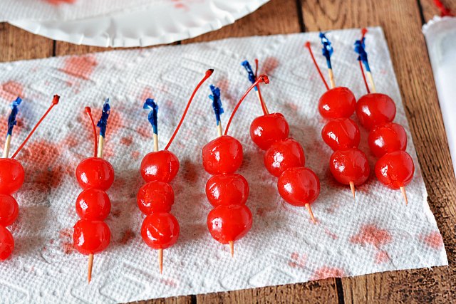 3 maraschino cherries on toothpicks