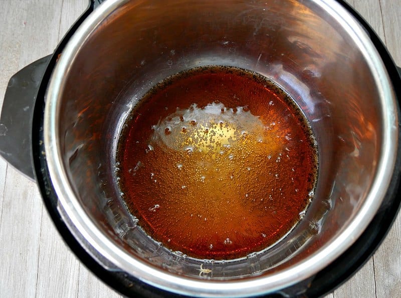 One cup of generic cola soda pop in the bottom of an Instant Pot as the liquid needed to cook ribs in an Instant Pot. 