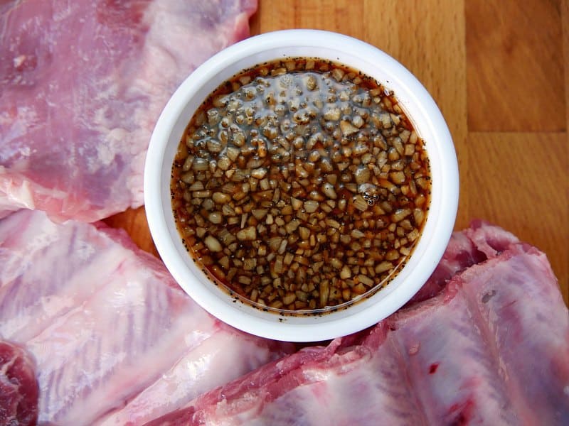 Wet rub made with brown sugar, liquid smoke, garlic surrounded by raw pork ribs. 