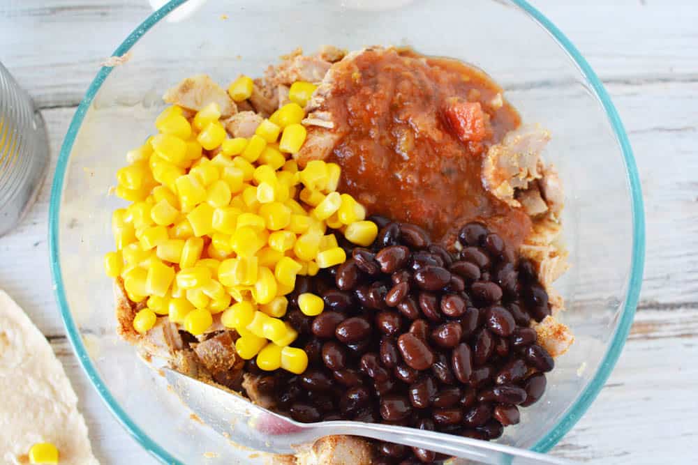 black beans, corn, salsa and spices in a mixing bowl
