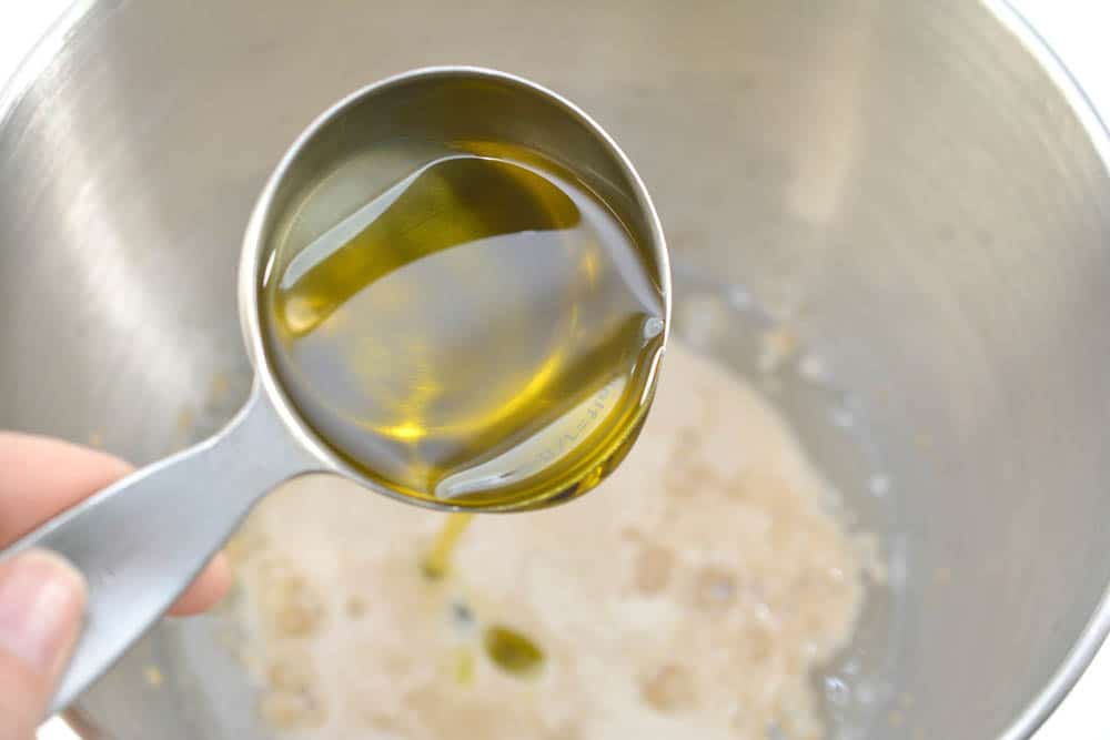 measuring cup of olive oil
