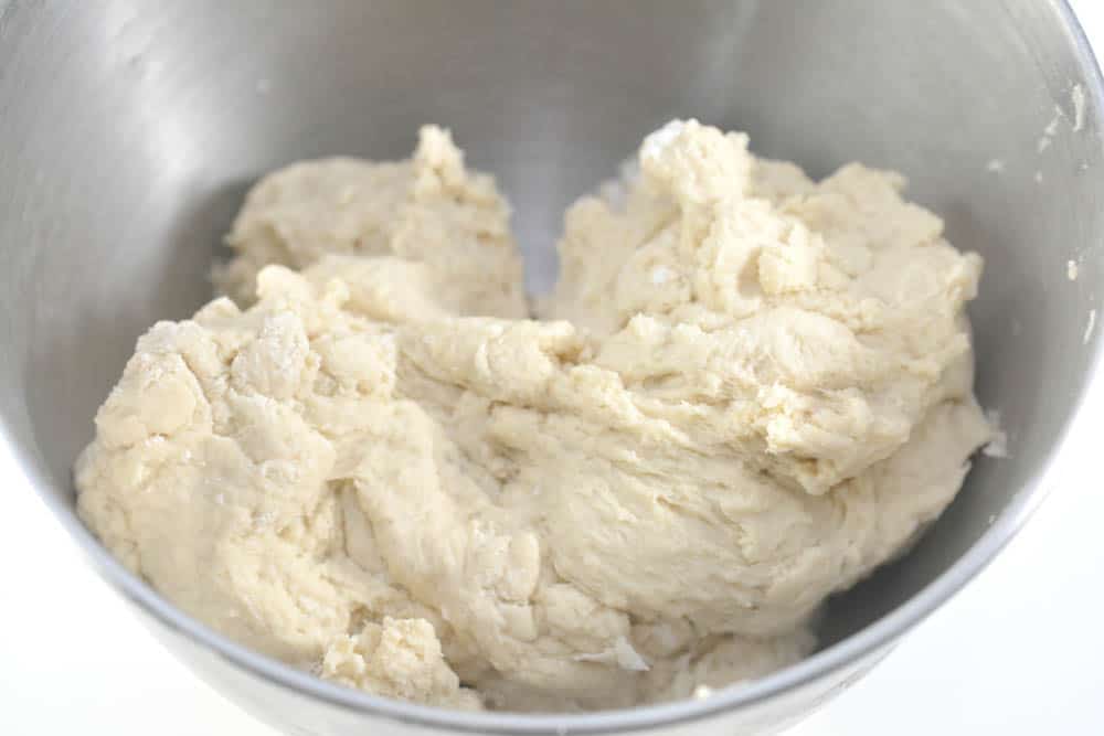 bread dough in a mixing bowl