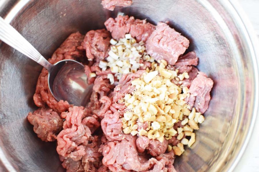 Ground beef and cashews in a bowl