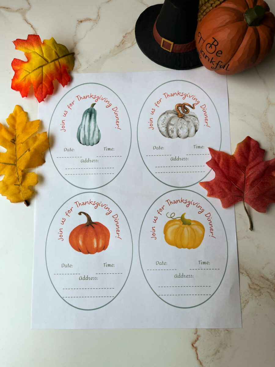 Thanksgiving dinner invitations printed out laying on a table