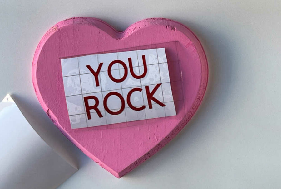 YOu Rock design on transfer tape on top of pink heart