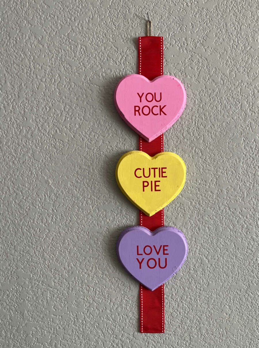 Conversation hearts decor hanging on wall