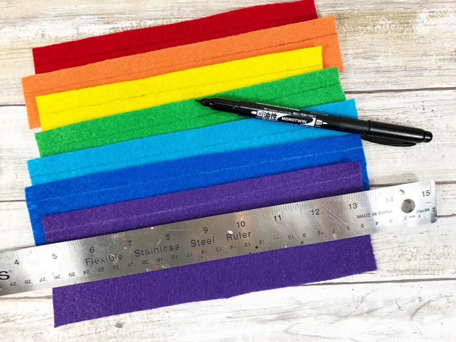 rainbow colored felt, marker and a ruler