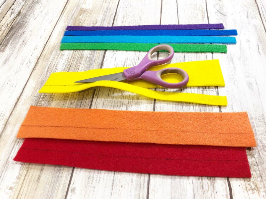 Rainbow colored felt and a pair of scissors