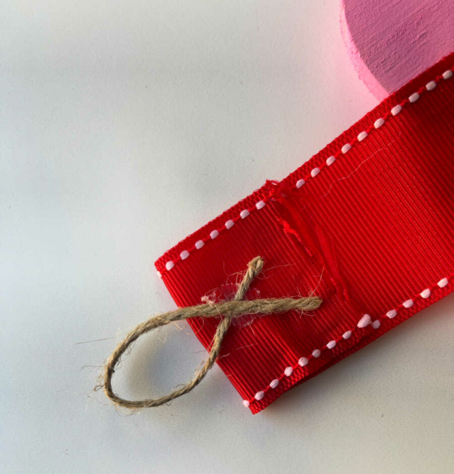 Twine hanger on red ribbon