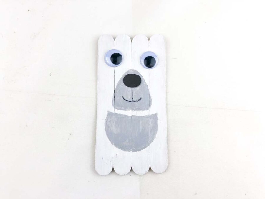 Polar bear popsicle stick craft with mouth and eyes