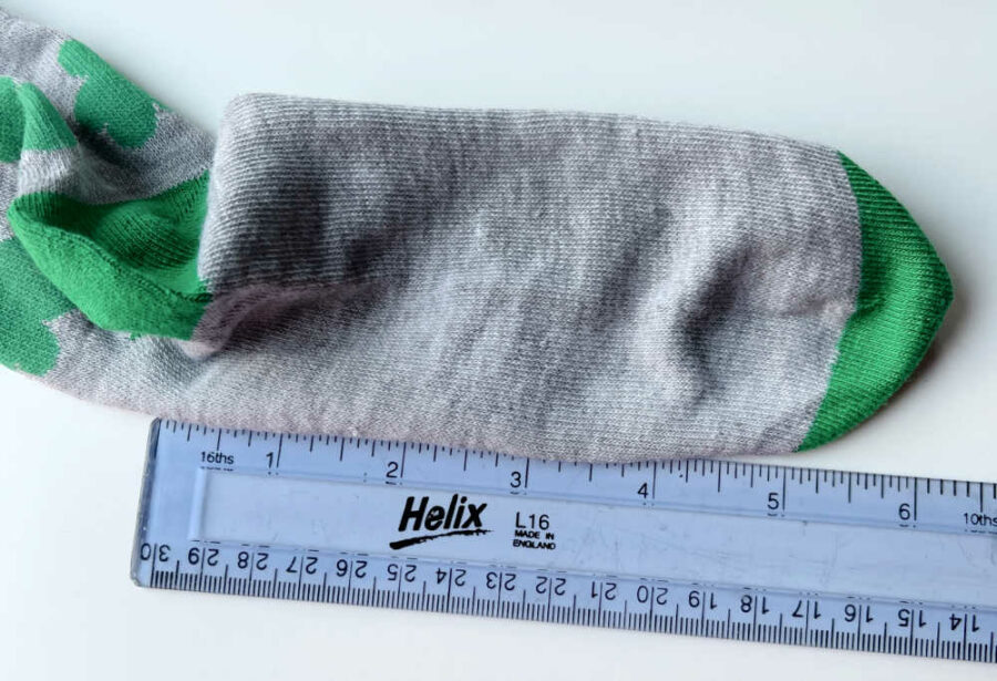 Sole of socks and a ruler