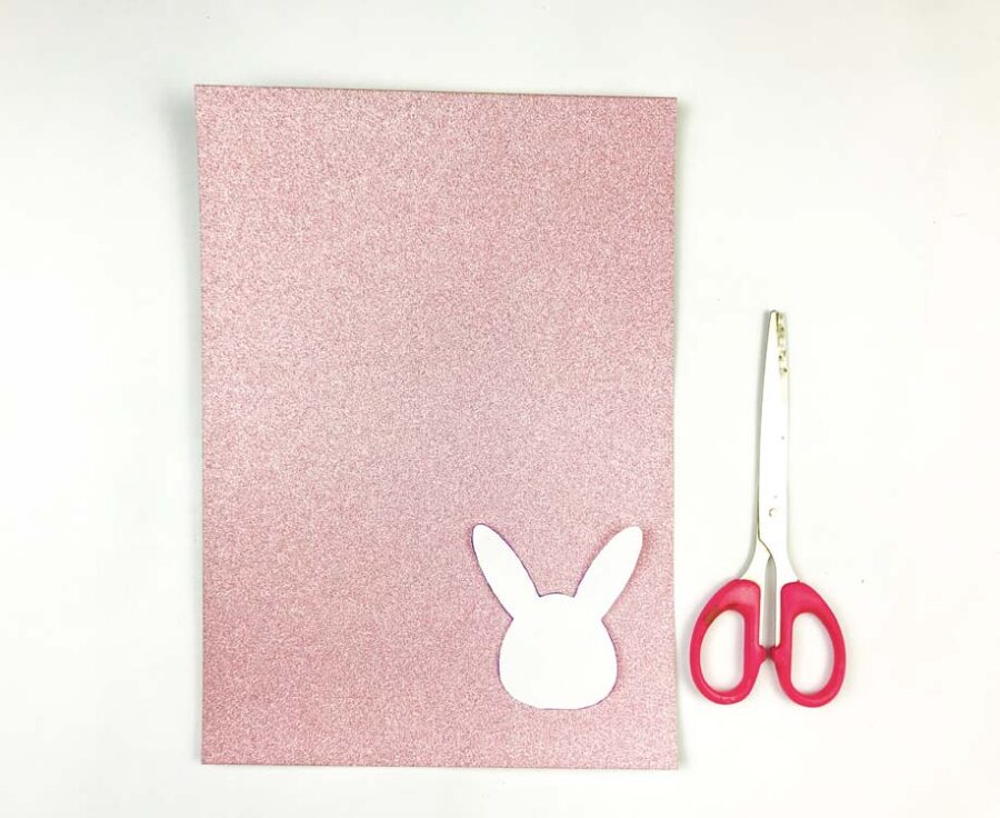 Bunny head template on a piece of glitter paper