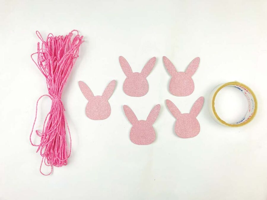 Yarn, bunny garland heads, tape