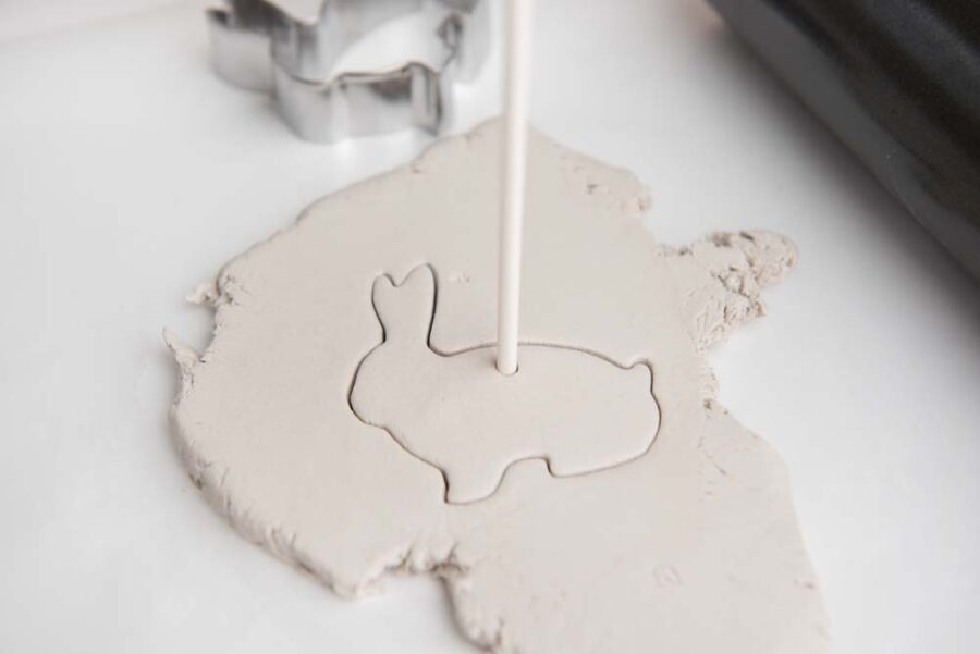 Bunny shape cut out in white clay with straw