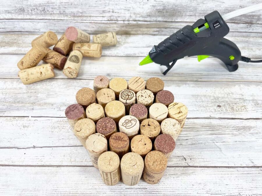 Wine corks on table with glue gun