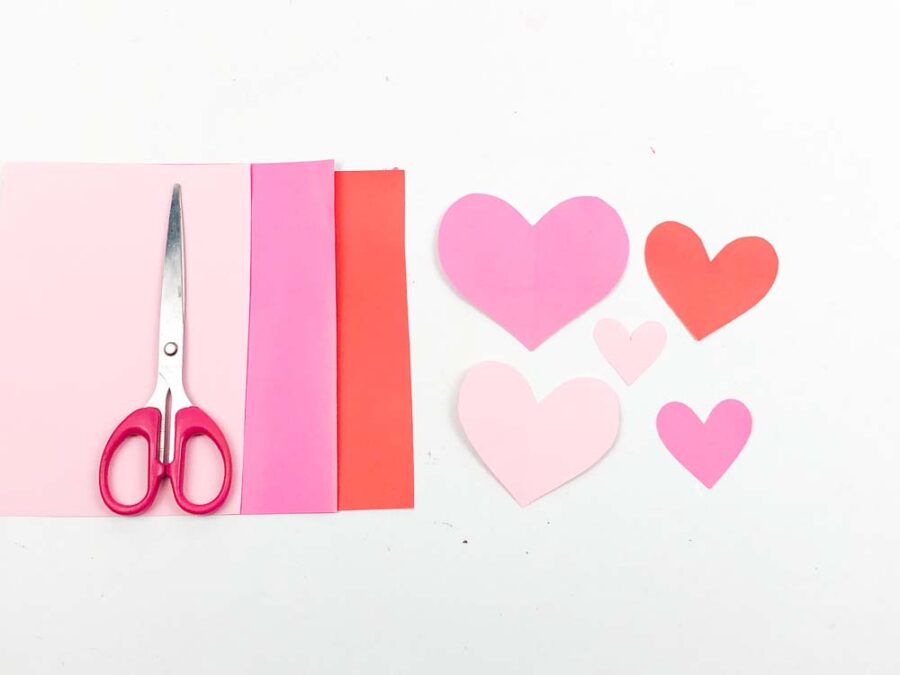 pink and red paper with hearts cut out