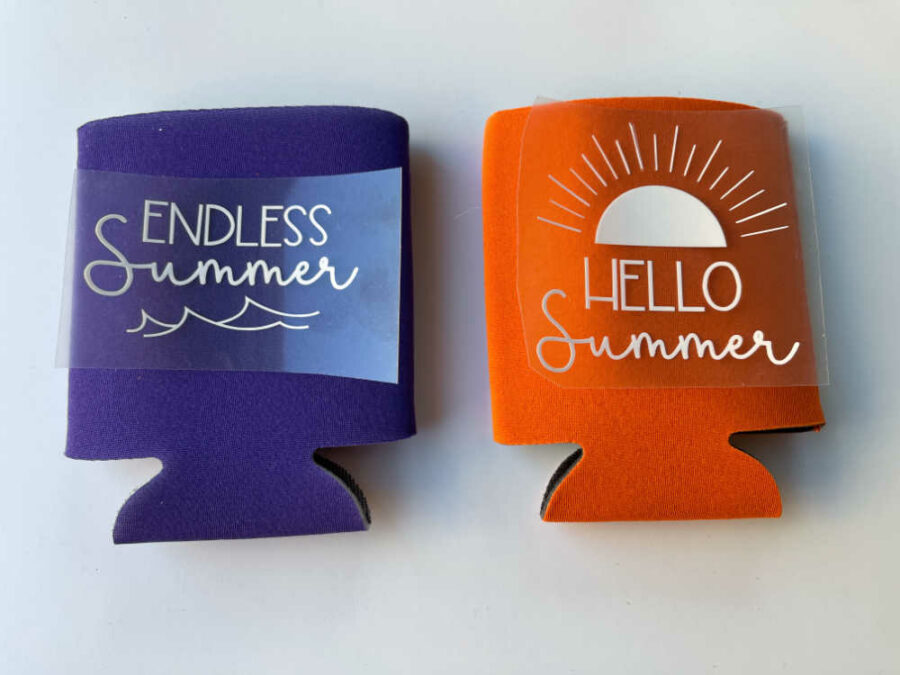 Purple can koozie with Endless Summer white vinyl and orange can koozie with Hello Summer white vinyl
