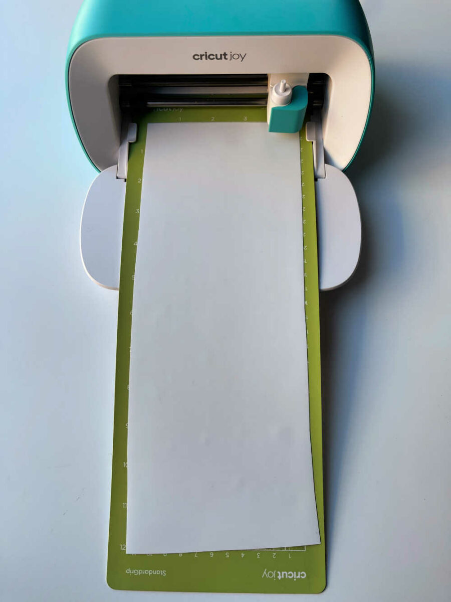 Cricut joy with green mat and white iron on vinyl