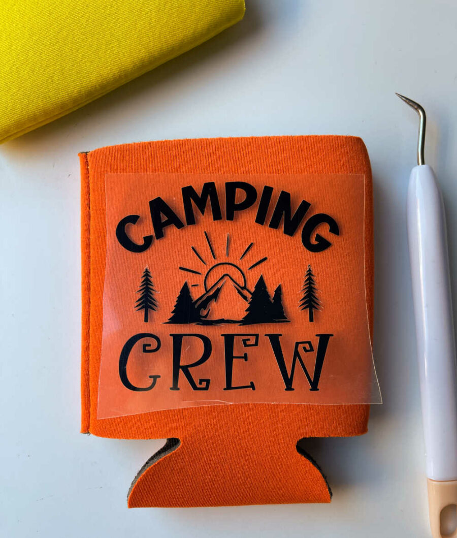 Camping Crew SVG weeded on top of orange can koozie