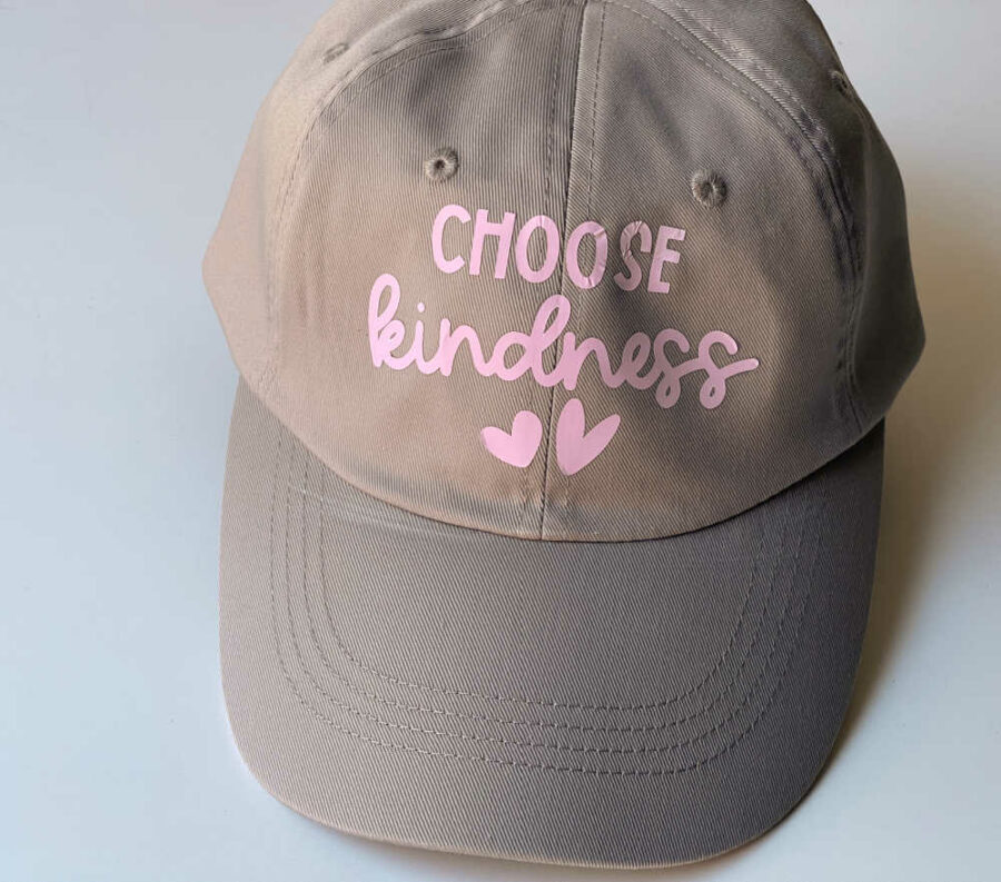 Kindness hat with color changing HTV before being in the sun