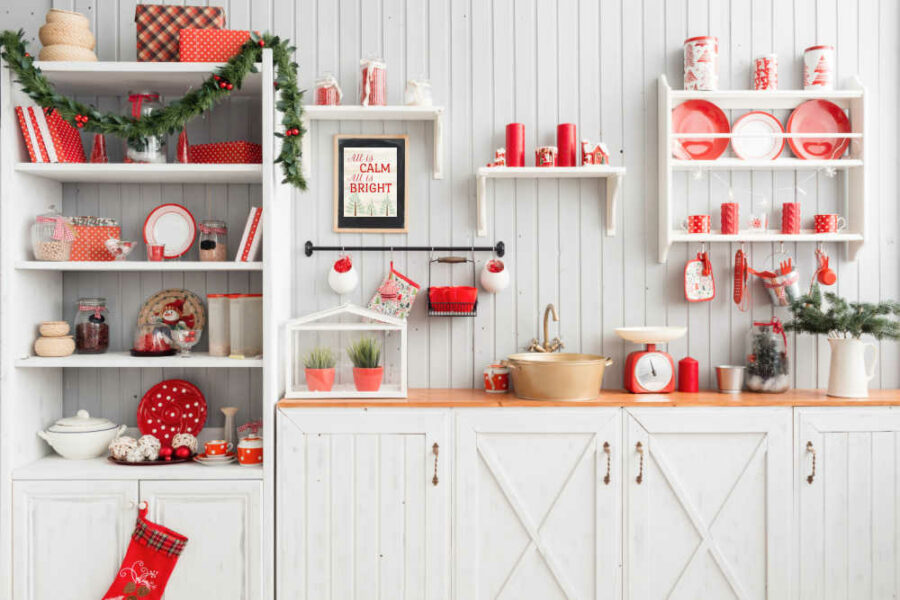 A kitchen decorated for Christmas with a Printable Christmas Wall Art hung up