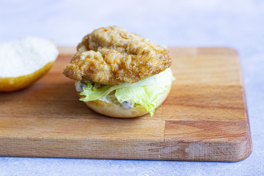 Chicken patty on a bun with lettuce