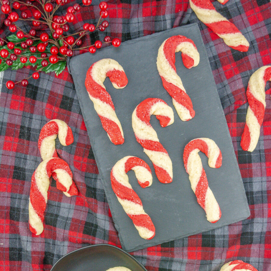 Candy Cane Shortbread cookies laying on a gray serving platter