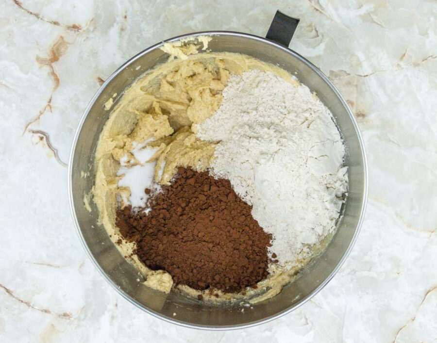 Dry ingredients with wet ingredients in a mixing bowl