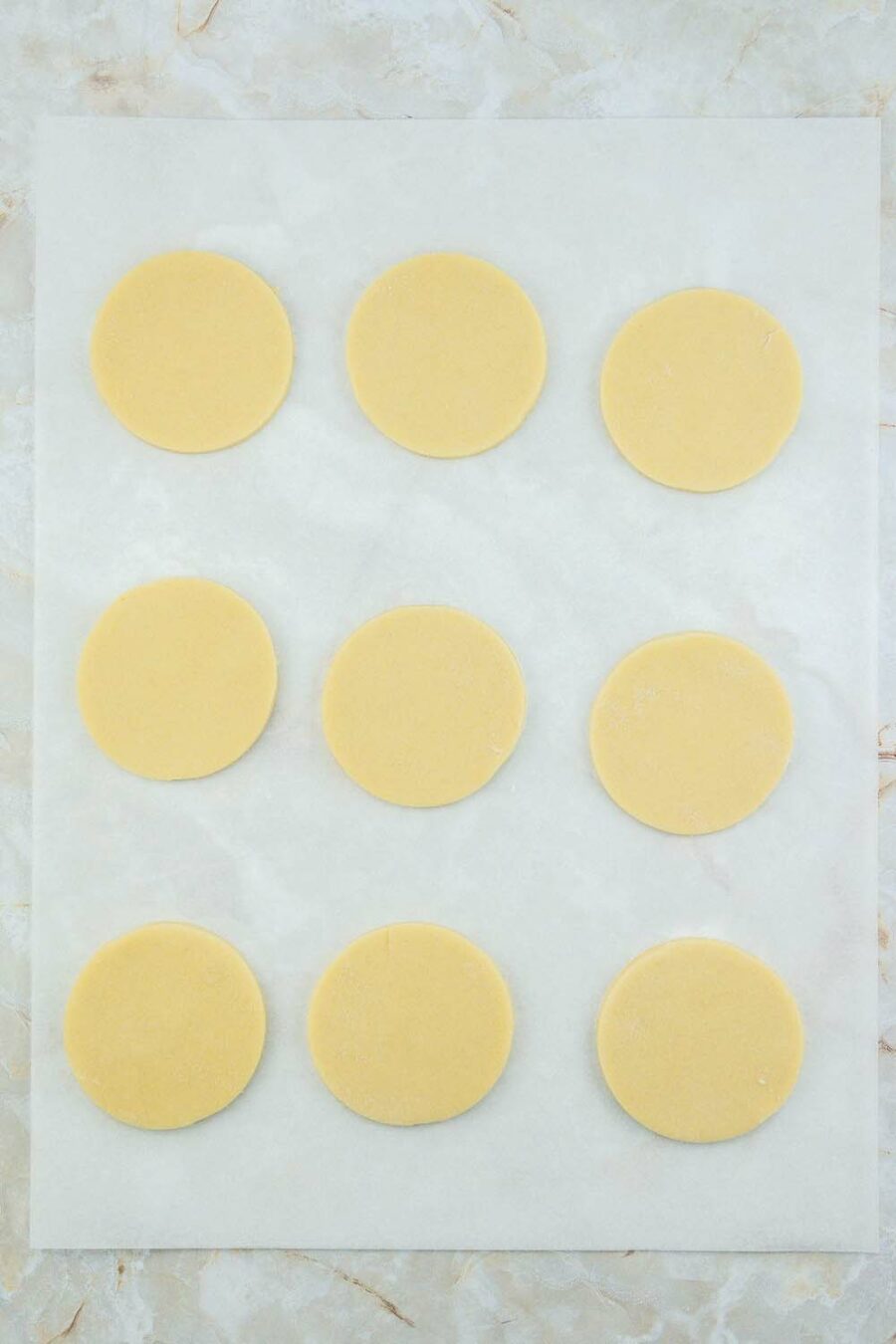 Cookie dough cut out with round cookie cutter
